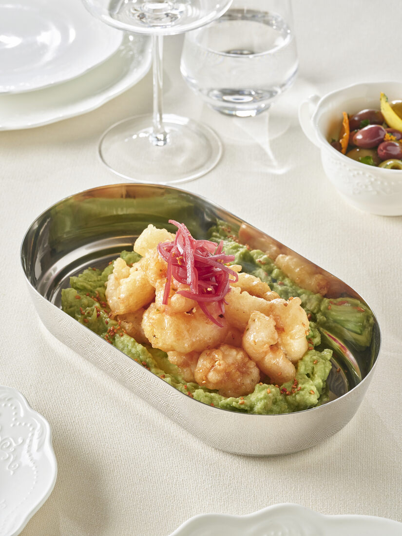 Tempura shrimp with avocado in an oval silver tray