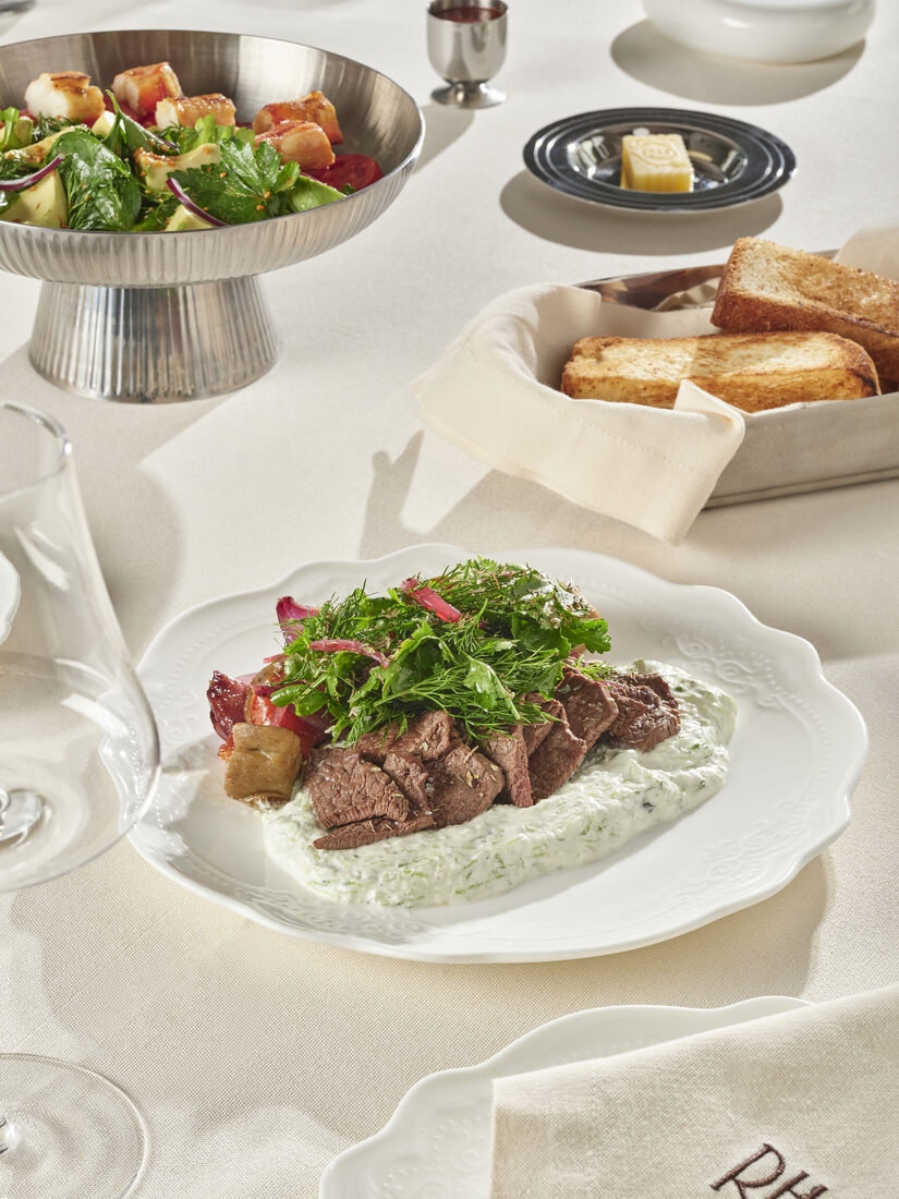 Herb-crusted beef with green sauce and the RH monogram napkin