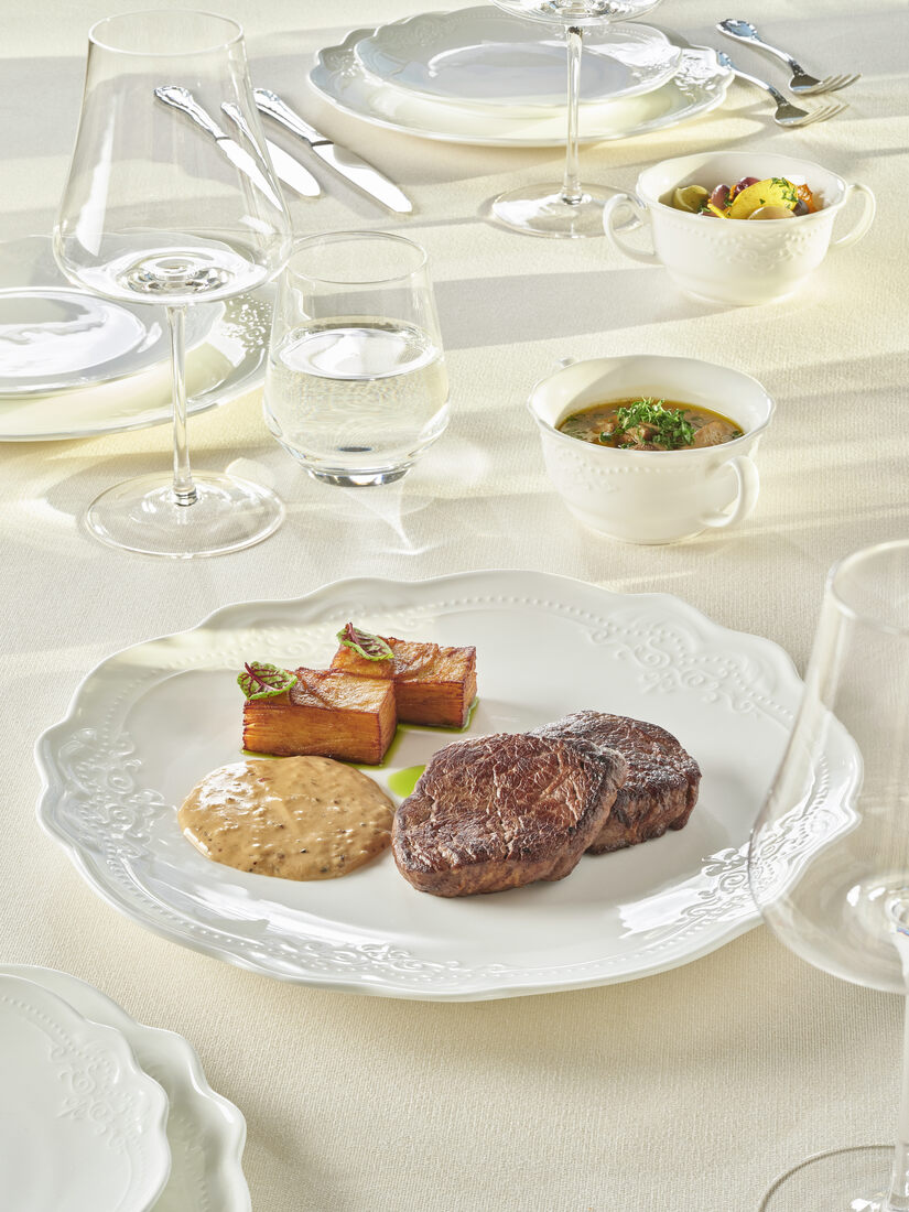 Chef's mixed main course — beef medallions, salmon confit and seasonal garnish